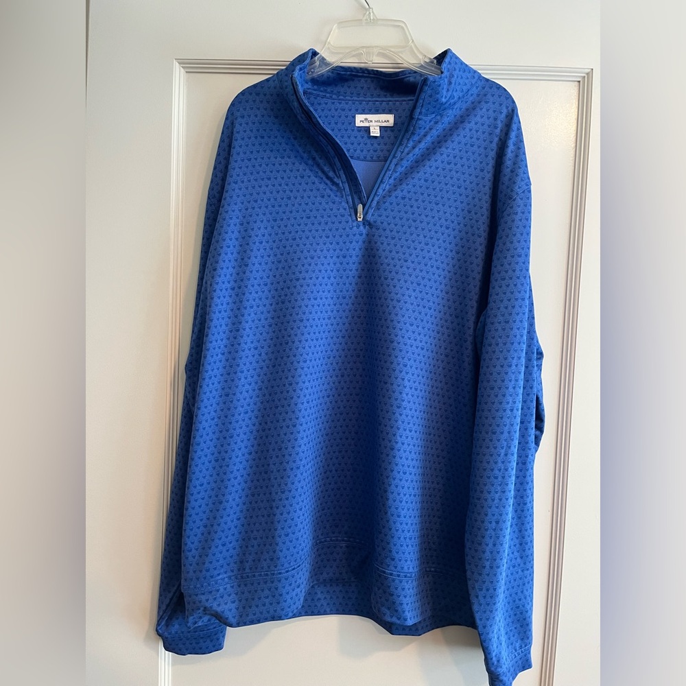 Peter Millar Men’s Blue quarter Zip with skull pattern.